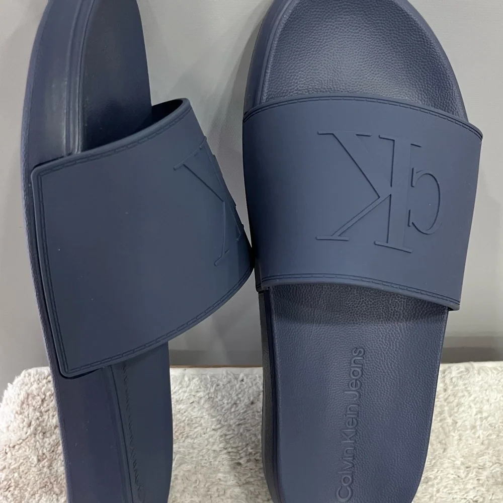Calvin Klein Medium Gray Embossed CK‎ Slide Sandals